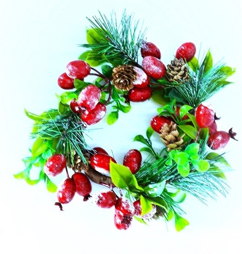 22078 - Wintery wreath. Vibrant green leaves, pine needles and cones with bright red berries floral display.  Size   Approx 230mm Diameter
