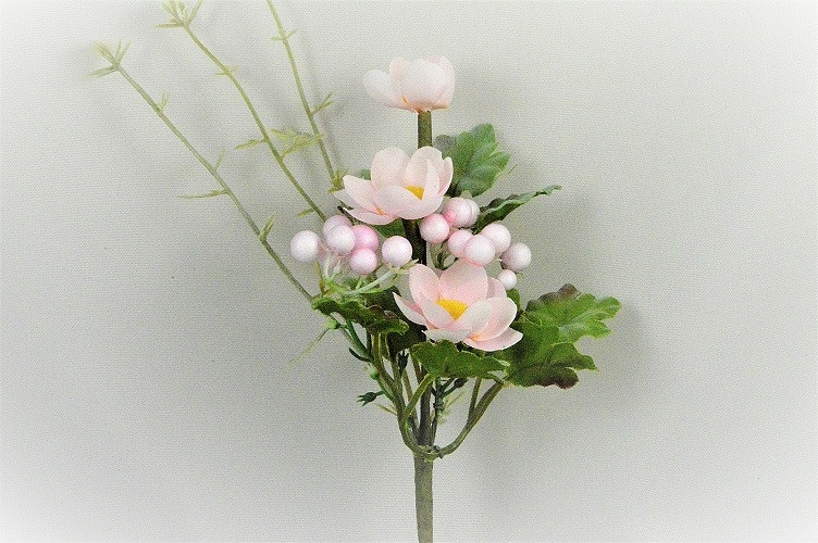 33007 - Spring floral arrangement.  Delicate pink petals surround a bright Yellow centre.  Height  21cms ,  Width  9cms  (approx )
