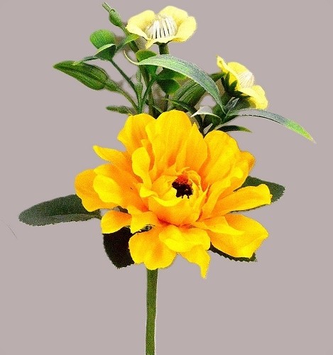 33009 - Bright Yellow floral arrangement accompanied with delicate Primrose flowers and leaves.  Height  17cms ,  Width  12cms   (approx)