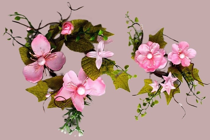 33018 - Delicate Pink Flowers wrapped with vibrant green leaves make these a lovely floral decorative arrangement.  Two Sizes Available.  