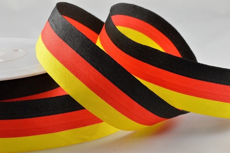 Y893 - 25mm Striped Flag Ribbon (25 Metres)-25mm- Black, Red & Yellow-25 Metres