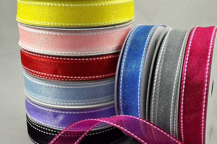 55123 - 16mm Sheer ribbon with a white saddle stitch x 20mts