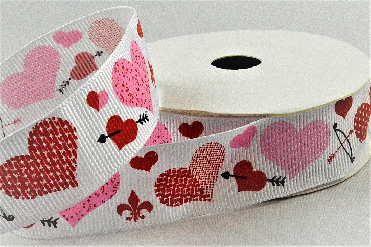 55137 - 22mm White grosgrain ribbon printed with a Love Hearts and Cupid Arrow design x 10mts.