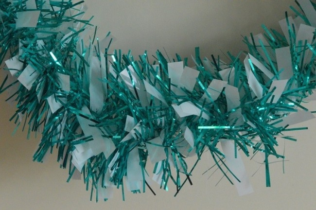 88134 - Aqua Coloured Tinsel with Hanging White Deco x 2 Metre Lengths!