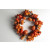22072 - Autumn / Halloween Wreath with an array of golden orange fruits and berries and a scattering of pine cones and bark. Measures  380mm diameter