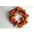 22072 - Autumn / Halloween Wreath with an array of golden orange fruits and berries and a scattering of pine cones and bark. Measures  380mm diameter